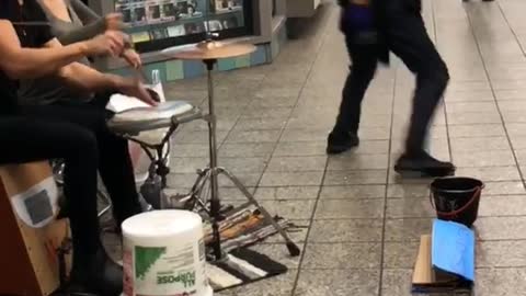 Subway drummers man white tank top wife beater dancing