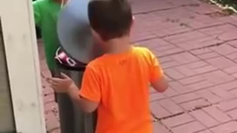 Kids Jokingly Hit Each Other With Trash Can's Lid by Stepping on It's Pedal
