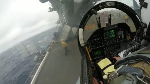 Very cool pilot's perspective of a carrier landing in bad weather with the F/A-18 Hornet.