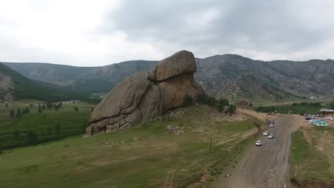 Aerial drone shot and beautiful zoom out turtle rock in Mongolia