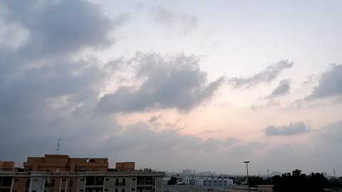 Dubai sunset now cloudy day