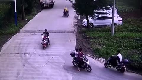 Chinese delivery driver throws stones at woman and her grandson after their scooters almost collide