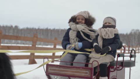 Watch the children in a horse-drawn cart