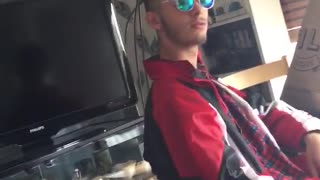 Guy taking off sunglasses with fake eyes underneath