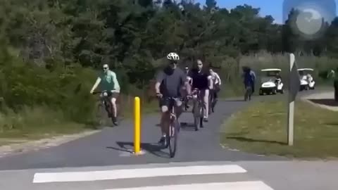 President Joe biden falls off bike