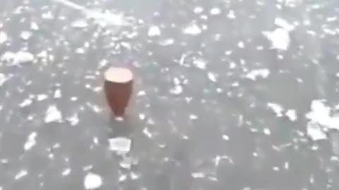 This guy shoots a frozen lake and the bullet spins - Inception style.