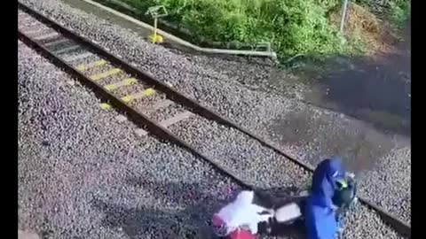 seconds a woman with her three children almost got hit by a train