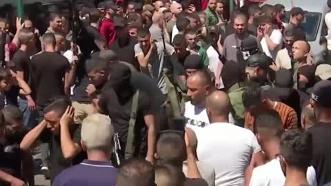 Two Palestinian gunmen killed in clash with Israeli forces mourned in funeral procession. | |