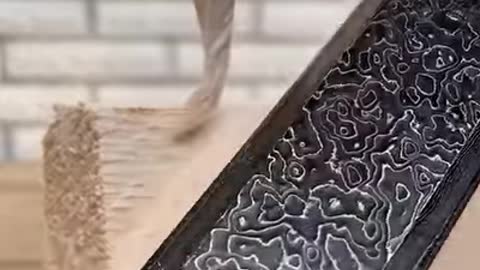 Carving a wood piece into an egg