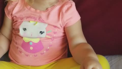 Toddler singing happy birthday to her mom