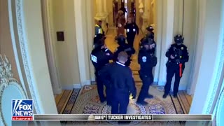 Never seen #j6footage shows Jacob Chansley being escorted through the Capitol by police.