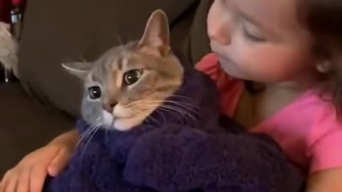 Cute Little Baby Girl Kissing Baby Cat