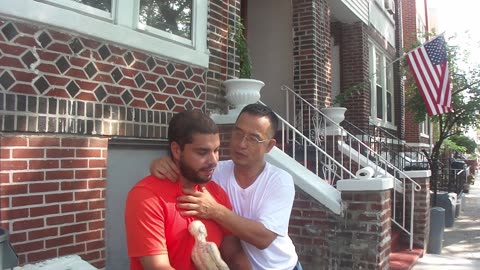 Luodong Massages Young Man On Sidewalk