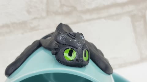 Polymer clay mug Toothless Viking. Gift How to train your dragon sit on a menthol cup by AnneAlArt.