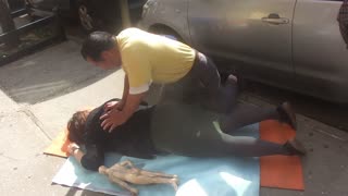 Luodong Massages "Mystery Woman" On Sidewalk