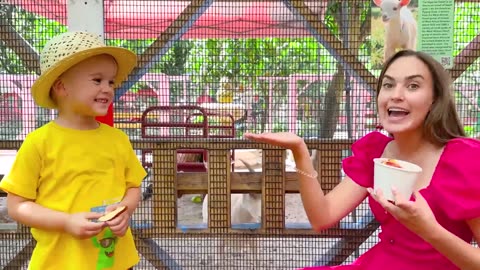 Chris and Alice feeding animals at the farm