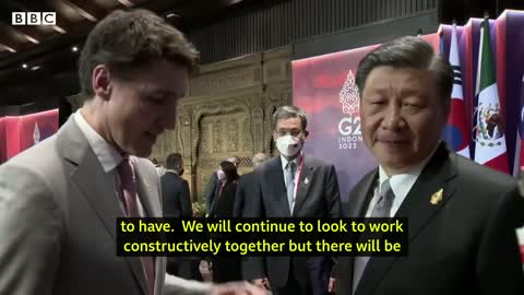 China and Canada leaders caught having tense exchange on camera - BBC News