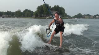 Guy completes his first wake surf 360