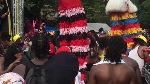 Mocko Jumbies Dancing on Stilts at the Labor Day West Indian American Carnival 2022