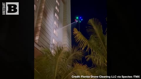 ALIEN WORKERS! Florida Business Uses UFO-Like Drone to Wash Windows