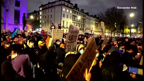 Protesters gather outside China's embassy in London