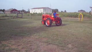 My Daughter driving her 1948 Allis Chalmers C