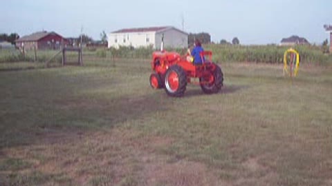 My Daughter driving her 1948 Allis Chalmers C