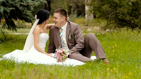 Happy newlywed couple in the park