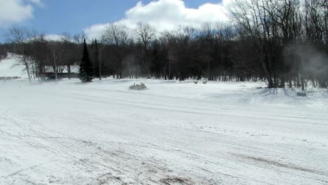 Man Sucked Under Snowmobile In Drag Race