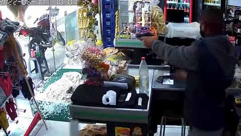 Armed robber surprised when store owner shoots him protecting his buiness.
