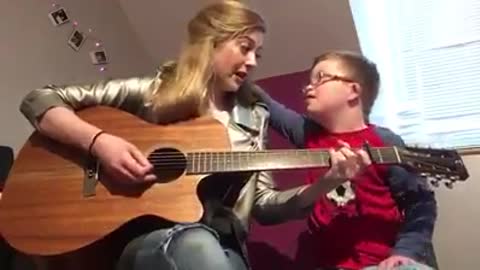 Girl Plays Original Song For Brother With Down Syndrome