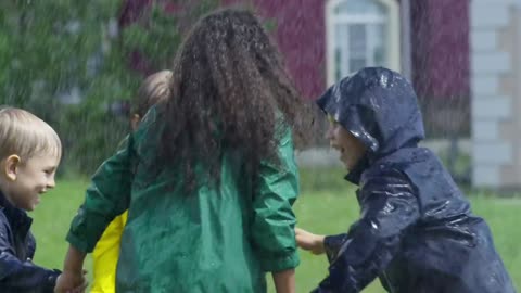 Children playing in a park getting wet by the rain 🌧️🌧️🌧️