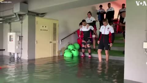 Japanese Rugby Players Brave High Waters to Train During Typhoon