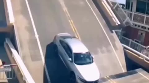 man almost dies as bridge is closing in on his car (MUST WATCH!)