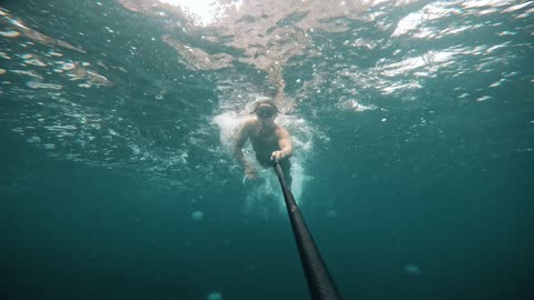 Man Snorkeling Gets Stung by Jellyfish