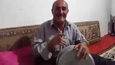 Man Sings and Plays Music with Pot