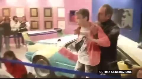 Italian climate cult vandalize a car painted by Andy Warhol.