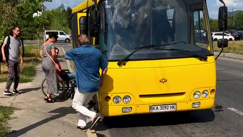 A bus driver helped a woman in a wheelchair