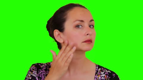 Portrait of beautiful woman touching face slow motion skincare on green screen.