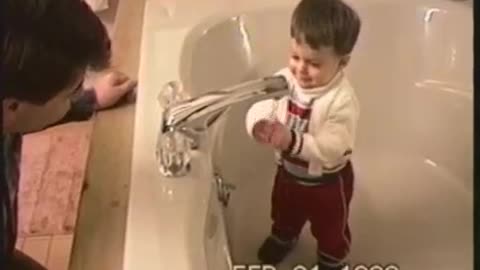 Home video reveals toddler's fascination with water faucet