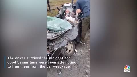 WATCH: Ukrainians Try To Pull Driver From Wreckage After Military Vehicle Runs Over Car