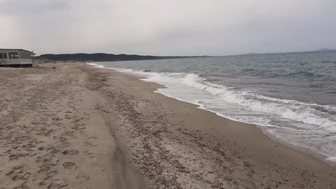 Fantastic view of the 2nd longest beach of Italy - waves crushing on the shoreline