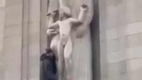 Brave man tearing Eric Gill's Pedo statue At BBC Headquarters