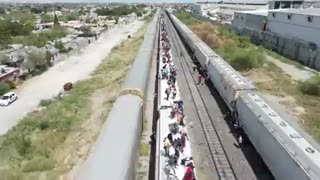 Drone footage captures the latest trains heading towards the US border