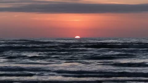 Sunrise over the Gulf of Mexico from Padre island nat'l seashore.