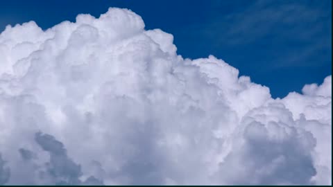 Clouds billowing across the sea.