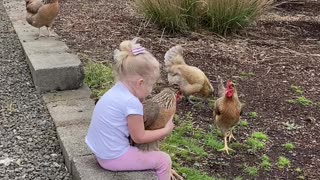 Child With Her Chickens