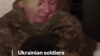 Ukrainian soldiers rescue 2 puppies from abandoned village