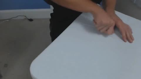 Cutting a table in half with plastic knives