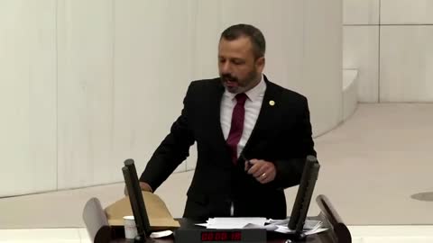 Turkish lawmaker smashes phone with hammer in parliament to protest social media bill